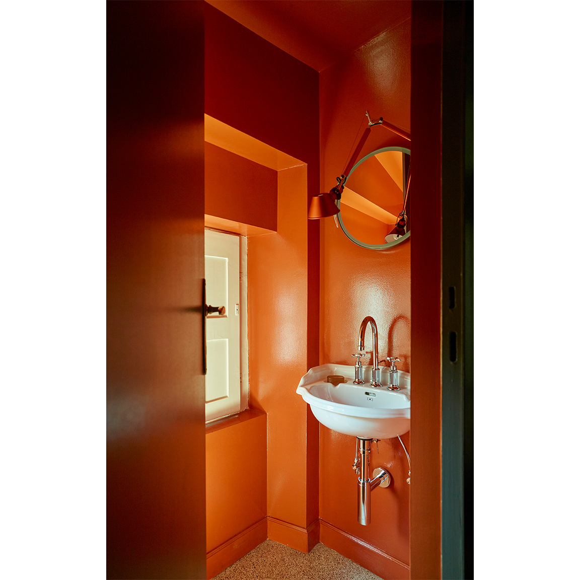orange bathroom with white sink