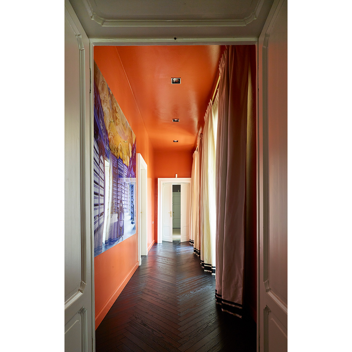 hallway with dark brown parquet