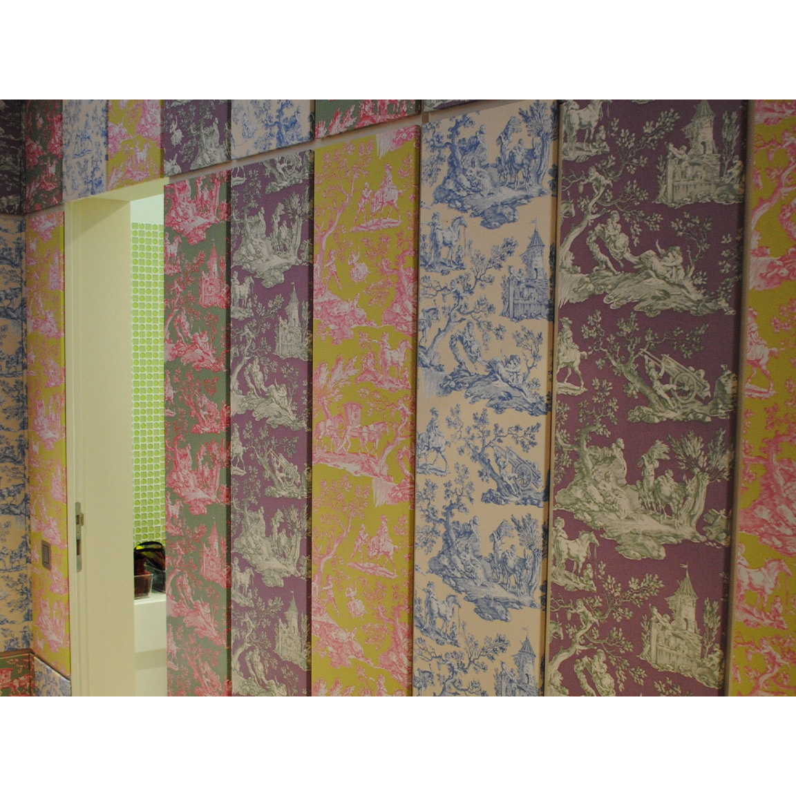 girls bedroom with patchwork paneling of toile de jouy