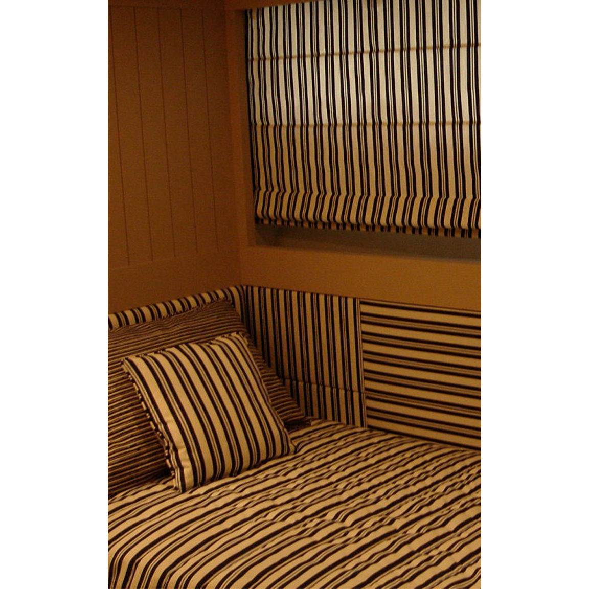 black and white striped bed and curtain