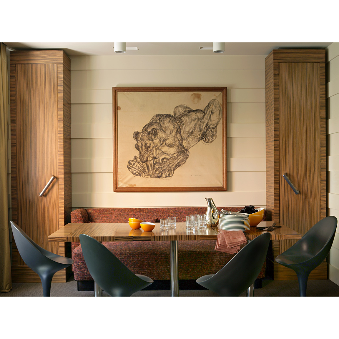 lioness painting above a dining table
