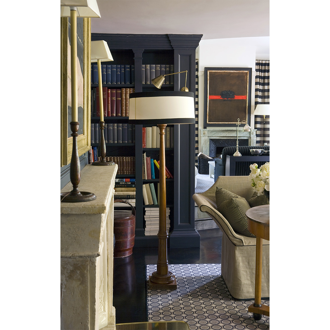 floor lamp with black and white striped lampshade and wooden body