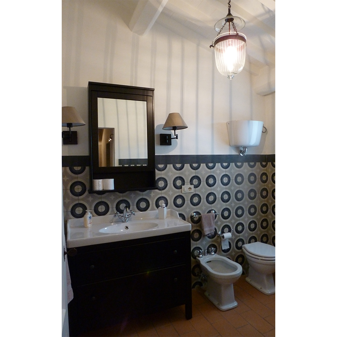 bathroom with black and grey tiles